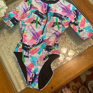 Multicolored size Large fits 12-14 women swim suit short sleeve EUC zips up